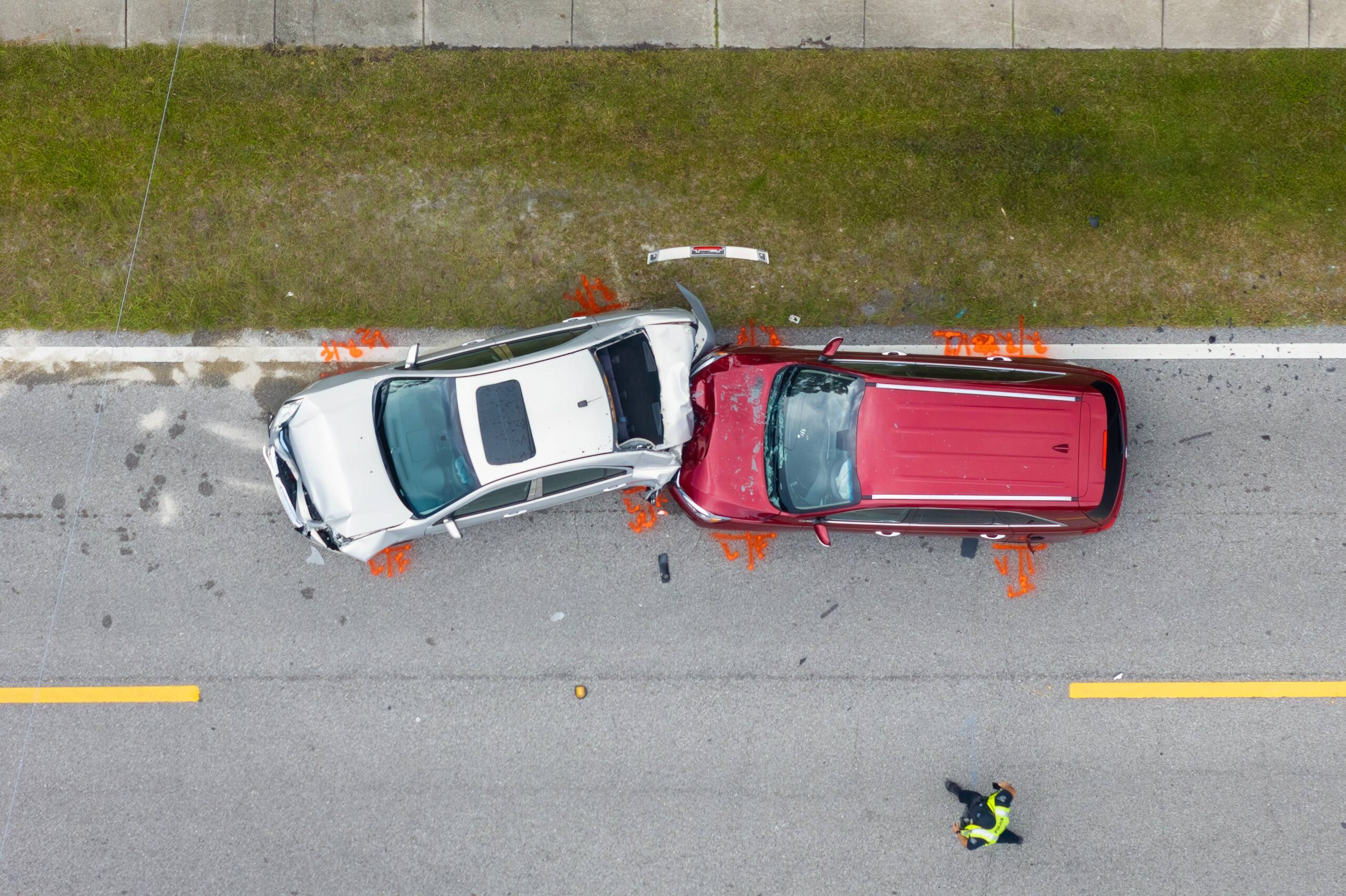 Louisville Car Accident Lawyer - Arial view of two cars stopped in the road after a car crash