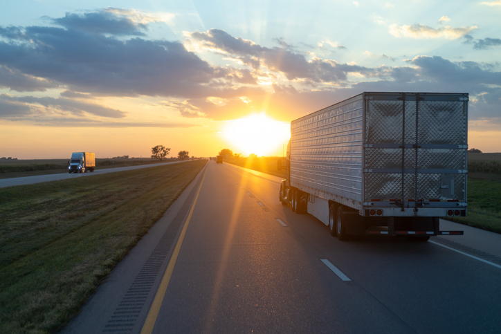 Truck driving down a highway at sunset - How much are most truck accident settlements?